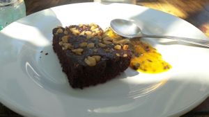 really tasty vegan brownie with passion fruit sauce at La Morada in Punta Del Diablo