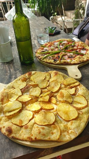 Pizza Lucile (front) and Pizza Mexicano (back) at Luv Burger in Nosara