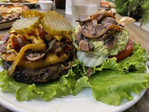 Philly Cheese with Grilled pineapple, extra pickles, extras mushrooms, added guacamole…total amazing vegan taste explosion insanity!! I want this to franchise all over SoCal!😍 at Luv Burger in Nosara
