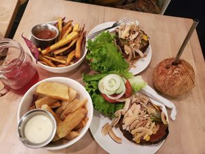 Coco bacon burger, tropical burger, yucca fries, sweet potatoes (ALL SO AMAZING!!!) 
 at Luv Burger in Nosara