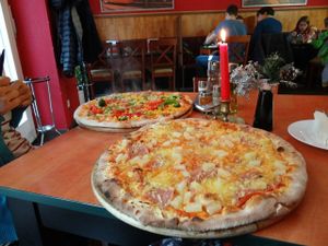 Vegan Hawaiian pizza in the front, broccoli pizza without cheese in the back.  at Roma Ristorante Pizzeria in Leipzig