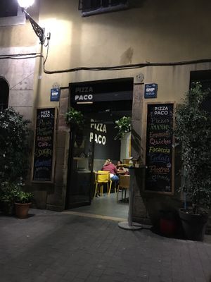 Outside at night at Pizza Paco in Barcelona