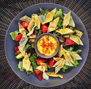 Fattoush Salad with Hummus (mix green salads, tomatoes, cucumbers, green onions, arabian pita bread chips, hummus) at Vege Joy in Varna