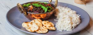 Dal Makhani (black lentils, tomatoes, onions, ginger, rajma, cream, coconut,  served with Basmati rice and mini papads)
– vegan option with soy cream  at Vege Joy in Varna