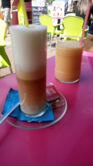 Latte with soy milk and fruit smoothie with seasonal fruit  at Gelatomania in Gran Canaria