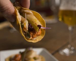 Corn Taquitos filled with the traditional Catalan Calçots (and everyones favorite calçot sauce) at Vegan Food Tours Barcelona in Barcelona