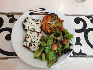Bifana sultan with green salad and veg at Graça 77 in Lisbon