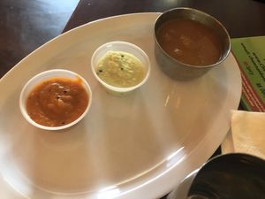 Tomato sauce , coconut sauce, and soup  at Chennai Dosa in Hicksville