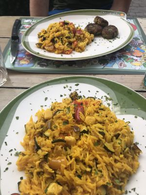 Cous cous and veggie burgers; paella  at Il Giardino delle Rane in Garda