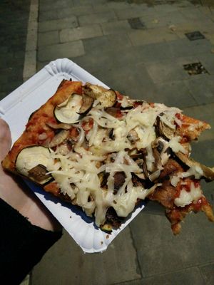 Vegan pizza slice at La Mezcla in Barcelona