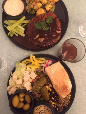 Vegan steak with rich gravy sauce and potato salad (top) + mezze plate with tofeta, picked veg, hummus, olives and pitta (bottom) at Los Vegos in Uppsala