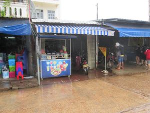 Current (12/10/2017) front of Kuadin restaurant with yellow 'chay' sign on right just before entrance to motorcycle parking area at Khouadin Vegetarian in Vientiane