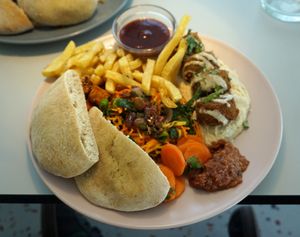 Falafel plate: homemade pita/falafels/hummus/carrot-persil salad/fries at Le Myrha in Paris