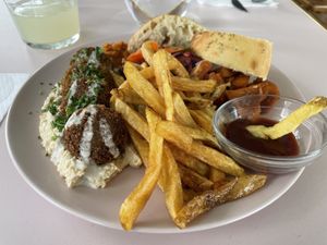 Falafel on hummus with fries and veggies   at Le Myrha in Paris