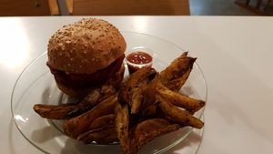 Burger (beetroot patty) with potatoes. at Le Myrha in Paris