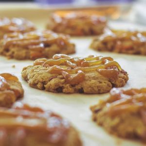 The Dolled Up Cookie: a chocolate chip, pecan, pretzel and caramel sauce covered crunchy cookie. at Dolled Up Desserts in Hamilton