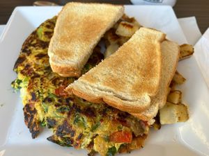 Vegan Omelette with vegan cheese, toast and house potatoes  at My Diner in Melrose