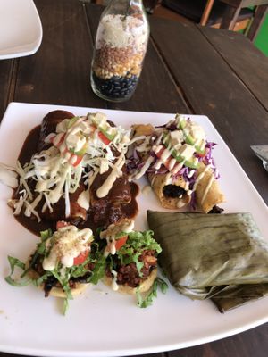 Plata a la mexicana - tamale, sopes, enchiladas  at Taqueria Entre Zankas in Zihuatanejo