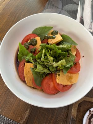 Caprese type salad. It used to be on the menu but I wasn’t when I visited. They were able to make it w/ a different almond cheese and it was good!  at Taqueria Entre Zankas in Zihuatanejo