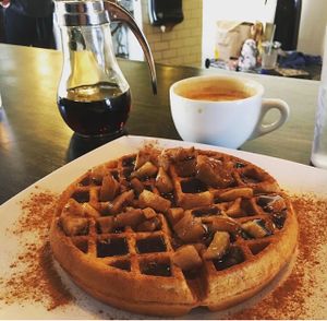 Vegan waffle with apples, syrup, and cinnamon.  at Black Coffee and Waffle Bar in Minneapolis