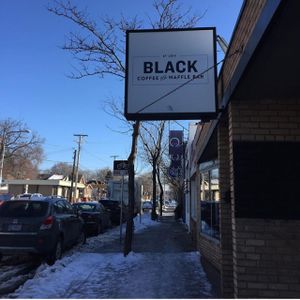 entrance w street parking out front  at Black Coffee and Waffle Bar in Minneapolis
