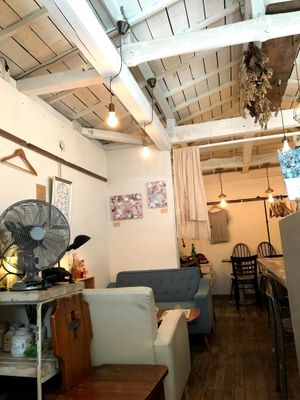 Nice cozy interior - dining area on 2nd floor, register and kitchen on 1st floor at Plus Veganique in Tokyo