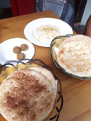 Garlic pide, cinammon pide whole meal pide with hummjs and baba ganush at Pita Bakery in Central Singapore