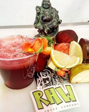 Strawberry, beet, ginger, pear, apple, bee pollen, lemon, dandelion cocao nibs and edible flowers. 
Happy Valentines Juice at Raw A Juice Company in San Francisco