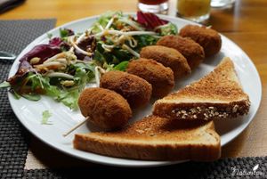 Vegan mushroom croquettes + salad with miso dressing + organic bread at Let Me Take You - Déjate Llevar in Gran Canaria