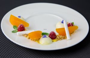 Williams pears on saffron with almond pudding and nut crumble at Orso Grigio in Cavalese