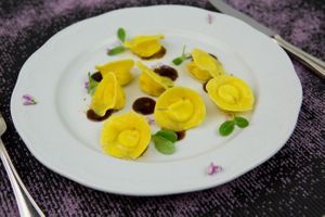 Home-made ravioli stuffed with goat ricotta-cheese, alpine hut butter and thyme at Orso Grigio in Cavalese