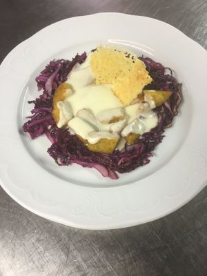 Brased red cabbage with "polenta" cornmeal mush and cheese fondue at Orso Grigio in Cavalese