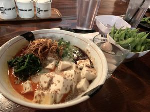 Spicy creamy vegan ramen, lycheetini, edamame    at JINYA Ramen Bar in Las Vegas