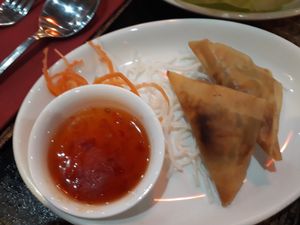 Golden Potato Samosas - Rice pastry packed with light curried potatoes. Served with home-made sweet chilli sauce at Singapore Orchid in Coulsdon