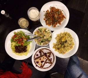 Miso ramen, tempeh with mashed potatoes and mix salad, porfal paste with artichokes and dried tomatoes in creamy sauce, buckwheat dumplings with mushrooms and seitan and cake with prunes and sour cream. at Animals in St Petersburg