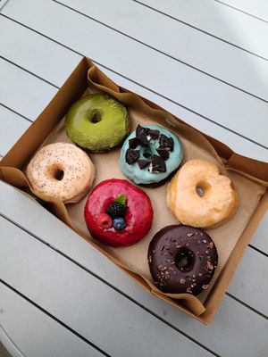From top right: matcha, mint chocolate w/ oreos, glazed, lemon poppyseed, triple berry, and chocolate w/ cacao nibs at Good Town Doughnuts in Costa Mesa