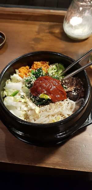 Vegatable bibimbap in hot stone bowl and guchujang at Bibimcup in Dusseldorf