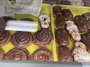 There too two trays are All Vegan Donuts.Cinnamon bear,crawl sprinkle doughnut,chocolate doughnut, cinnamon bear claw with chocolate swirl  at Donut Xpress in Ontario