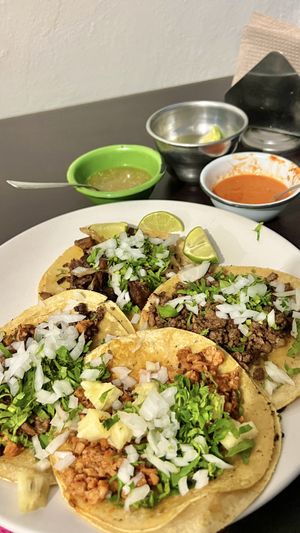 Tacos served with lime slices and two salsas  at VEGuerrero in Mexico City