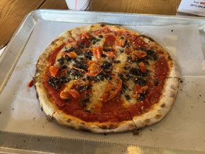 Custom pizza with vegan cheese, mushrooms, basil, and roasted tomatoes.  at The Tomato Shack Salad & Pizza co in West Chester