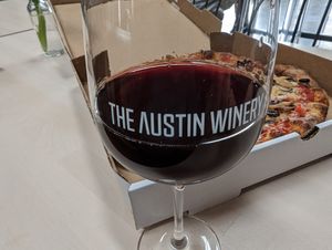 Li'l Nonna's patrons can dine inside the wine bar adjacent to the trailer.  The "Spaghetti Western" is a fine pairing with the pies. at Li'l Nonna's in Austin