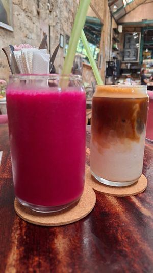Pink smoothie & iced latte with oat milk at Lazy Cats  in Ubud