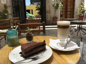 vegan cake and cappuccino at Omphalos in Arequipa
