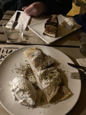 (Front) crepes with hazelnut filling, (back) creamy chocolate cake   at Haiku in Palermo