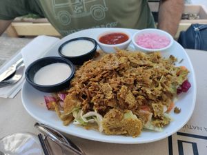 Kebab with a creamy sauce, garlic sauce, spicy sauce, and ginger sauce at Haiku in Palermo