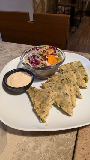 Farinata with hummus and salad at Haiku in Palermo