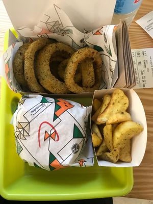 Burger, wedges and onion rings! :) at La Trocadero in Barcelona
