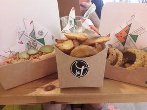 Hot dog, potato wedges and onion rings at La Trocadero in Barcelona