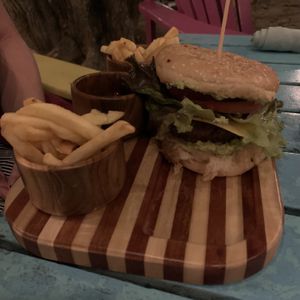Vegan burger, super tasty, fries were on the soggy side. at Noguis in Tamarindo