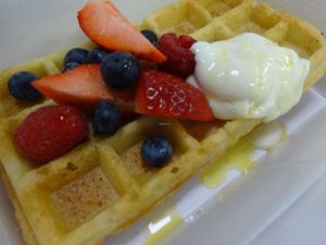 Waffle, Rosewater orange syrup, Yogurt and berries (Vegan) at Riverside Cafe in Leicester